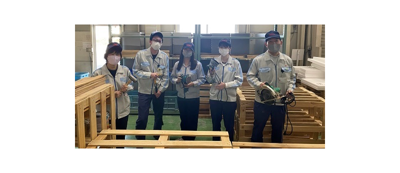 Friends recycling waste pallets