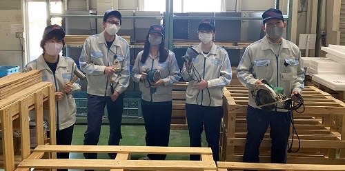 Friends recycling waste pallets